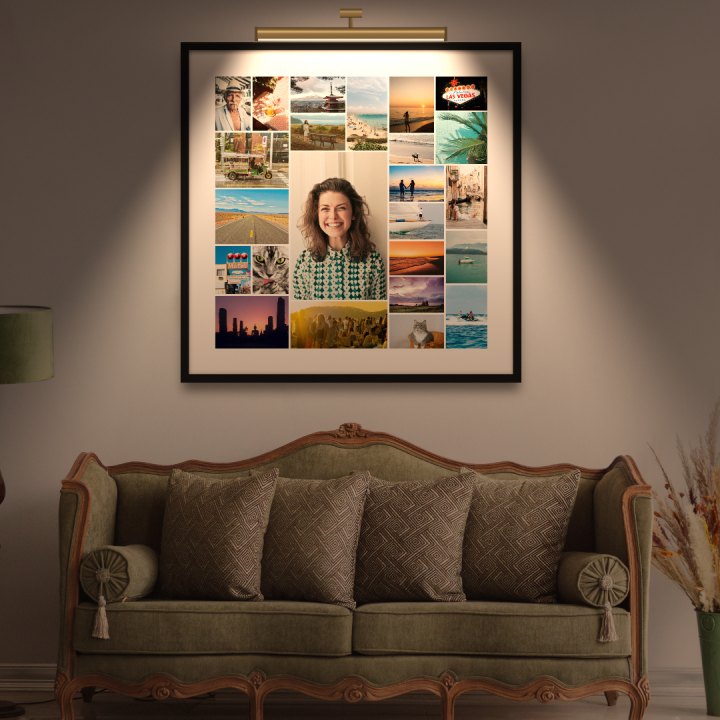 A collage of 24 holiday photos, with a smiling woman in the centre, framed on the wall above a sofa under a picture light. Made automatically in Collage Studio